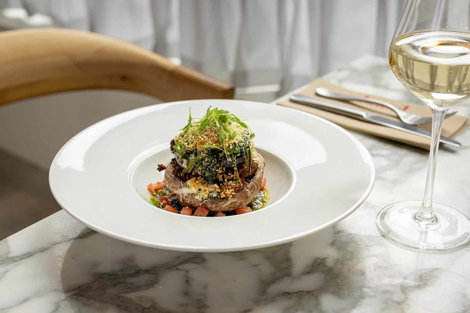Colourful dish with white wine